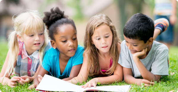 kids reading outside