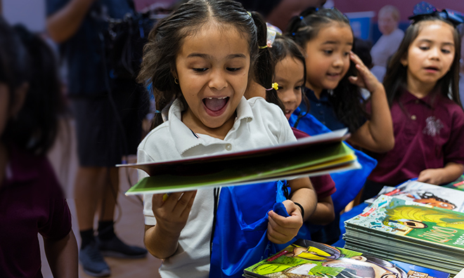 girls joyful at a book celebration