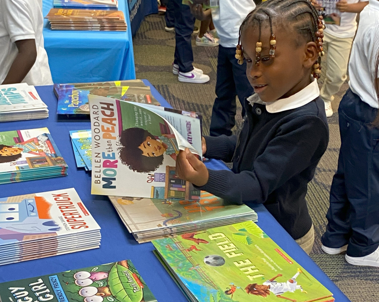 Book selection table at RIF - Macy's - Detroit school library